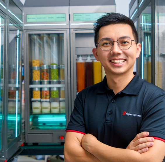 man smiling wearing black polo shirt